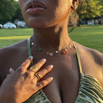 Load image into Gallery viewer, Close-up of a person wearing jewelry with a park background
