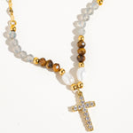 Load image into Gallery viewer, Necklace with beads and a cross pendant on a white background