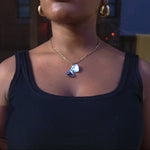 Load image into Gallery viewer, Person wearing a black tank top and gold necklace with a heart pendant.
