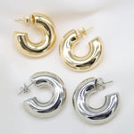 Load image into Gallery viewer, Gold and silver hoop earrings on a white background