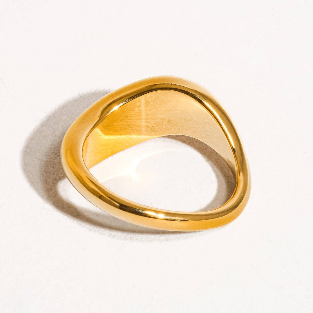 Gold ring on a white background