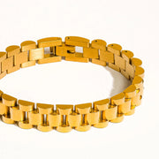 Gold chain bracelet on a white background