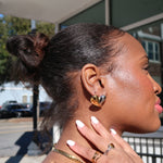 Load image into Gallery viewer, Woman with styled hair and jewelry outdoors