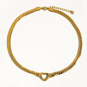 Gold chain necklace with a heart clasp on a white background