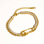 Load image into Gallery viewer, Gold bracelet with clear stones on a white background
