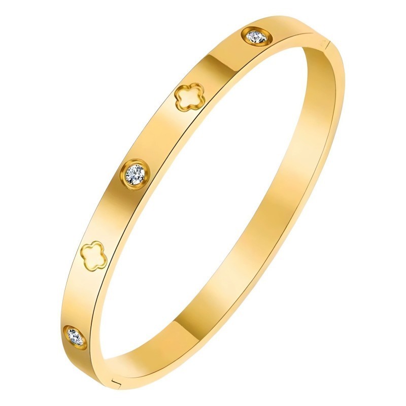Gold bracelet with diamond accents on a white background